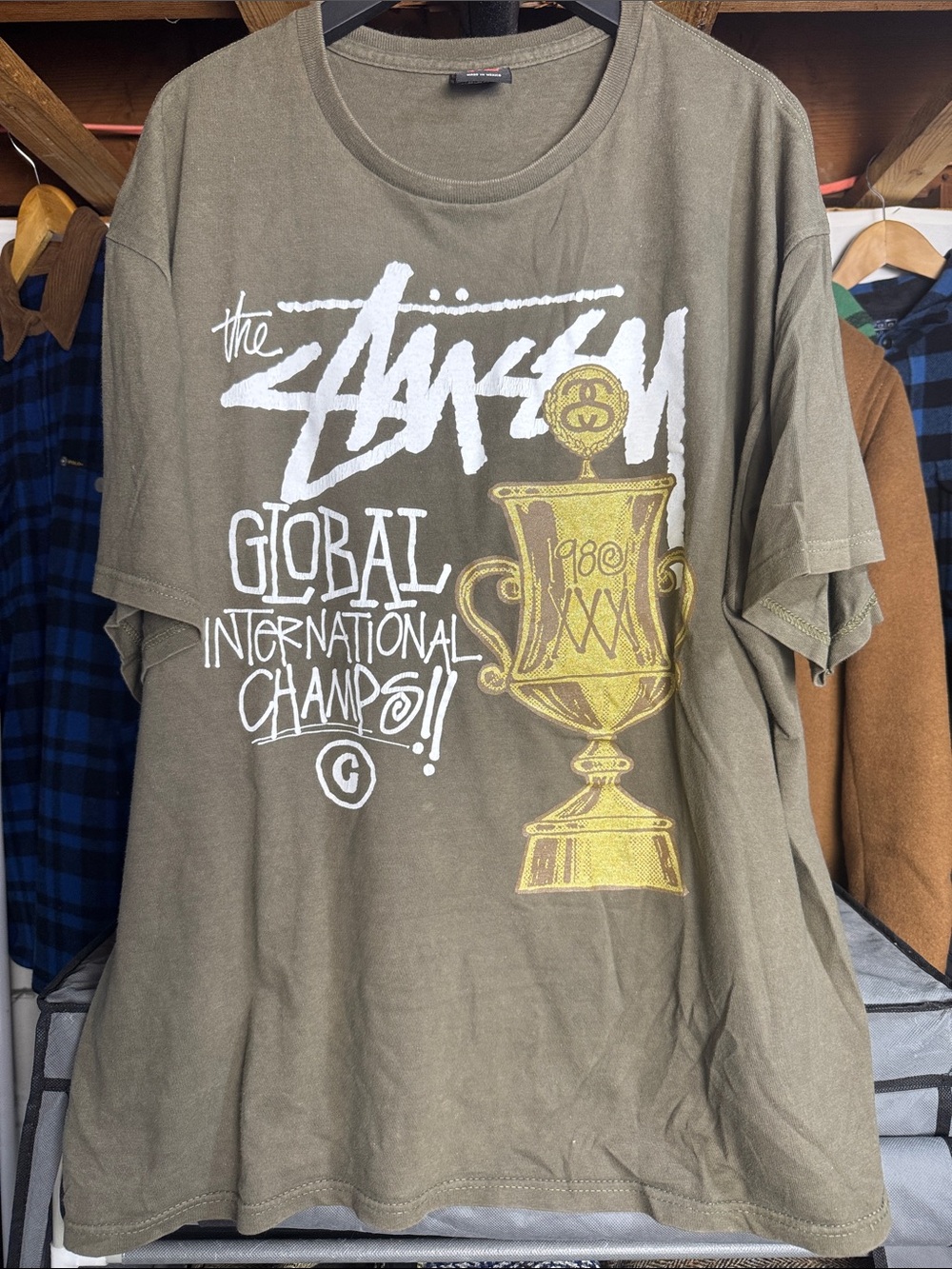 Stussy Olive Short-Sleeve Tee with White Logo & Gold Trophy